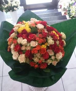 Romantic happy bouquet with 50 mini-roses of different colors