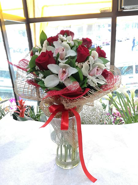 Seductive bouquet with 11 red roses and 10 white orchids