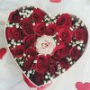 18 red and 1 white rose, packed in the shape of a heart with gipsofil