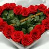 Heart-shaped arrangement with 19 reddish ruffles and amorous arrow